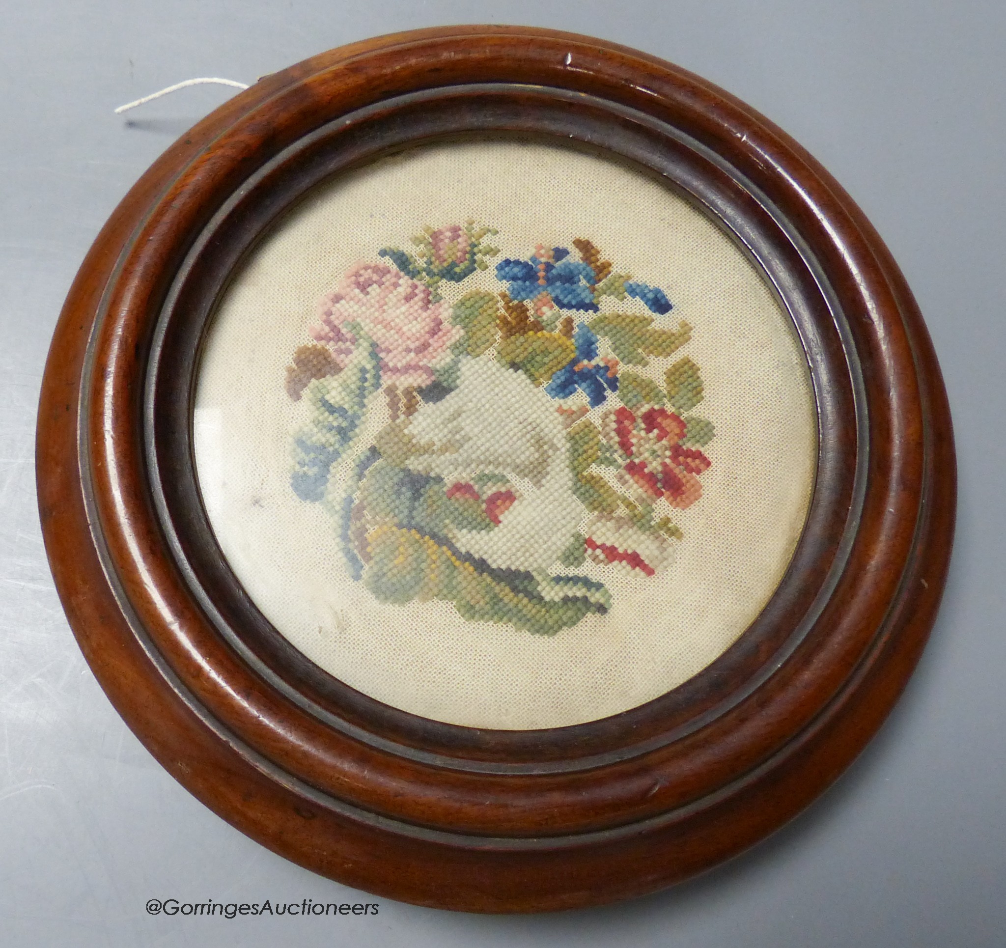 A petit point Victorian mahogany framed coaster, 23cm